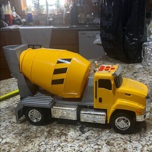 Cat plastic cement mixer lots of buttons that make it work